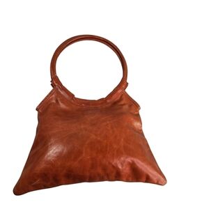 Cydwoq Ny tangerine glazed leather circle ring handle handbag purse